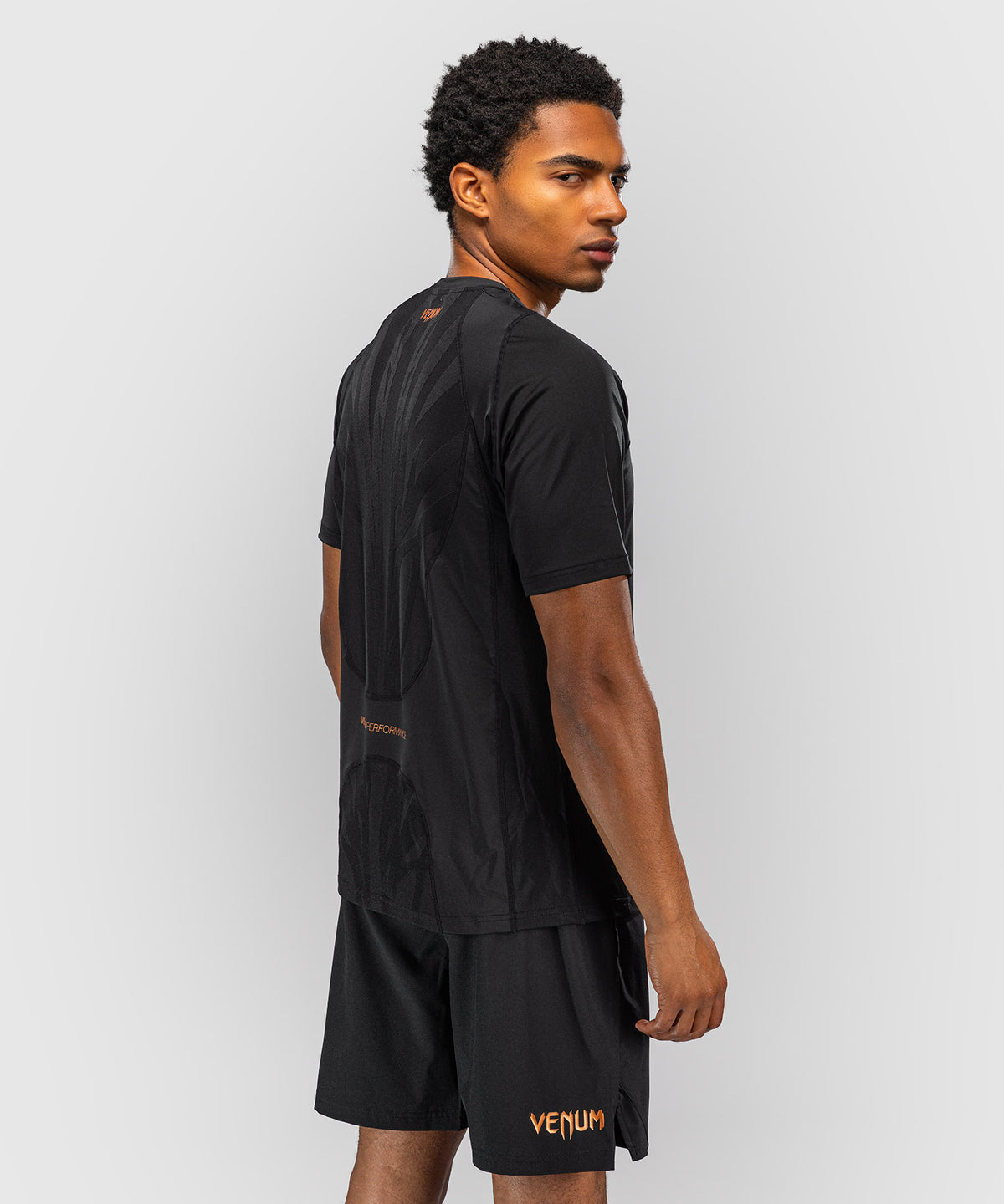 Venum G-Fit Revolution Camiseta Dry Tech - Negro/Cobre