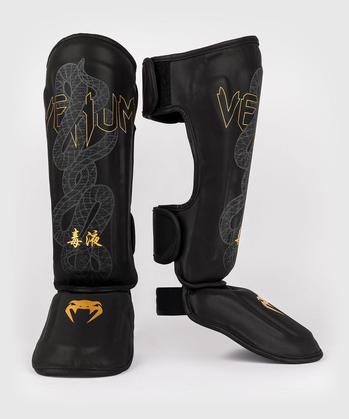 Venum Serpenti Espinilleras – Negro/Plata/Dorado