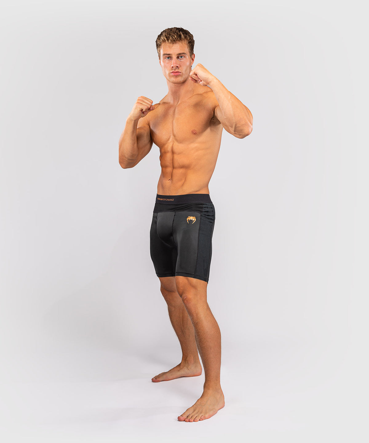 Venum G-Fit Revolution Vale-Tudo-Shorts - Schwarz/Kupfer